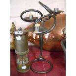 A vintage Prima brass miner's lamp - sold with a modern wrought iron three branch candelabra