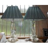 A pair of modern faceted glass table lamps with shades