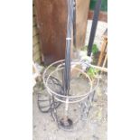 A quantity of garden wrought iron metalware including table base, plant stands, etc.