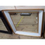 A gilt framed bevelled wall mirror with milled white glass border