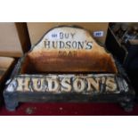 A reproduction cast iron Hudson's soap advertising dog water bowl