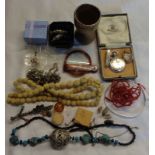 A bag containing assorted collectable items including silver collared wooden egg cup, costume