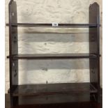 An early 20th Century stained wood wall mounted three shelf open bookcase