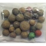 A bag containing old clay marbles