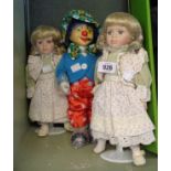Two modern porcelain headed dolls - sold with a similar clown figure