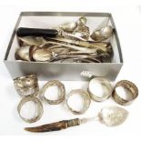 A small collection of silver plated cutlery including two sifter spoons and E.P.N.S. napkin rings