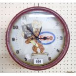 A reproduction Esso tin wall timepiece with battery movement
