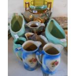 A selection of ceramic items including large majolica flower encrusted vase, jugs, planters, etc.