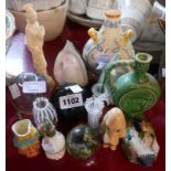 A selection of ceramic and glass items including Quimper frog, SylvaC dog, paperweights, etc.