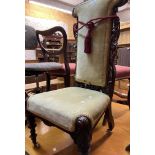A Victorian carved mahogany part show frame prie dieu chair with upholstered back and seat, set on