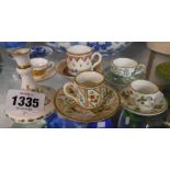 A small selection of bone china miniature cup and saucers including Coalport, Wedgwood Caverswall,