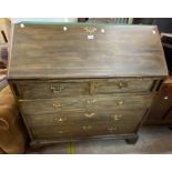 A 1.07m antique mahogany bureau with fitted interior over two short and three long graduated