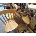 A harlequin set of four reproduction blonde wood kitchen chairs comprising three standard and one
