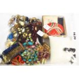 A bag containing assorted costume jewellery