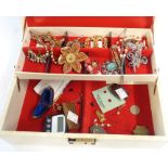 A jewellery box containing costume jewellery and a white metal locket