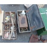 A wooden box containing assorted fixtures and fittings including hinges, bolts, plumbing fittings,