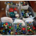 Seven tubs of assorted vintage marbles including opaque swirl, etc.
