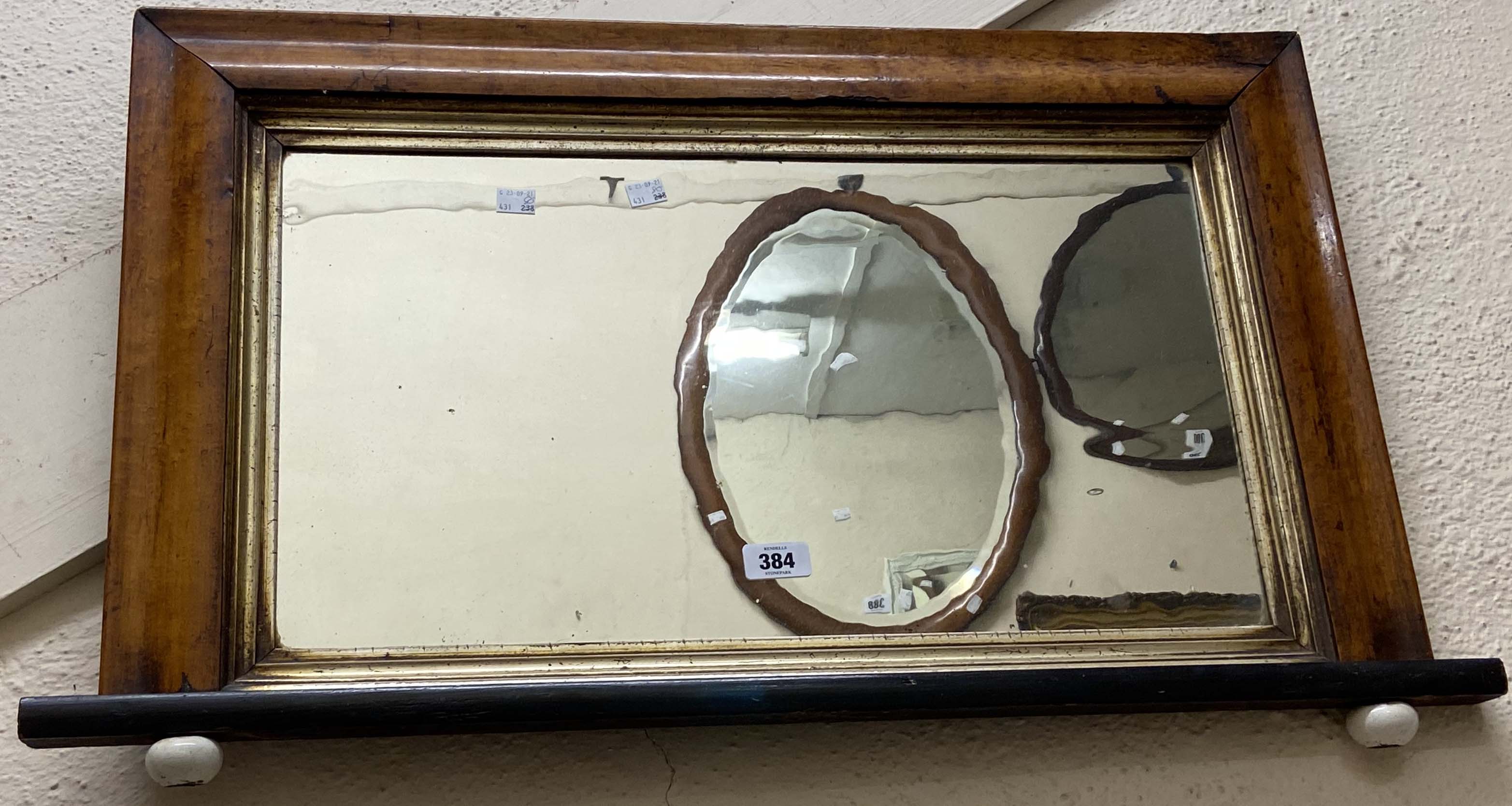 An 80cm Victorian maple framed and gilt slipped overmantel mirror with porcelain pommels under -