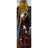 A vintage leather sports bag containing four squash rackets - sold with seven other vintage and