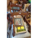 A late Regency mahogany framed open scroll elbow chair with upholstered seat, set on turned front