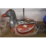 A Mexican pottery duck figurine with hand painted finish