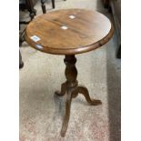 A modern polished pine pedestal wine table with tripod base