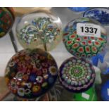 Four vintage paperweights including Perthshire, Millefiore, carpet ground, etc.