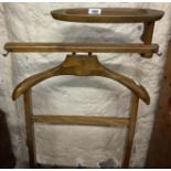 A vintage stained wood valet stand with cuff-links tray to top