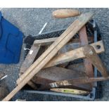 A crate containing assorted woodworking tools