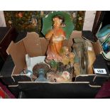 A box containing a 1930's mantel clock depicting a shepherdess and sheep - sold with a similar