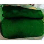 A bag containing a quantity of green baise