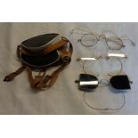 A bag containing a small quantity of vintage gold rimmed spectacles, goggles, etc.