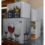 Five boxed sets of Dartington crystal glasses comprising tumblers, wine glasses, brandy balloons,