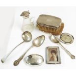Two silver British Bull Dog Club spoons, antique ladle, two small frames, jar top, two brushes and a