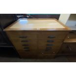 A 92cm vintage mixed wood sloping lift-top file chest with two flights of four partitioned and metal