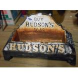 A reproduction cast iron Hudson's soap advertising dog water bowl