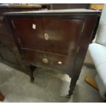 A 48cm 19th Century mahogany and cross banded pot cupboard with two doors and drawer under, set on