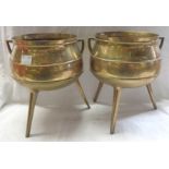 A pair of late 19th Century three legged brass cauldrons