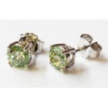 A pair of marked 750 pale green diamond solitaire stud ear-rings - boxed - approx. 1.3ct. TDW