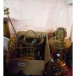 A box containing a selection of brassware including model rocking chair, WWII brass shell cases,