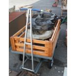 A large heavy duty metal garden trolley with added lift-out timber sides and removeable posts