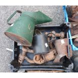 A crate containing assorted tools comprising a small vice, D shackles and oil cans