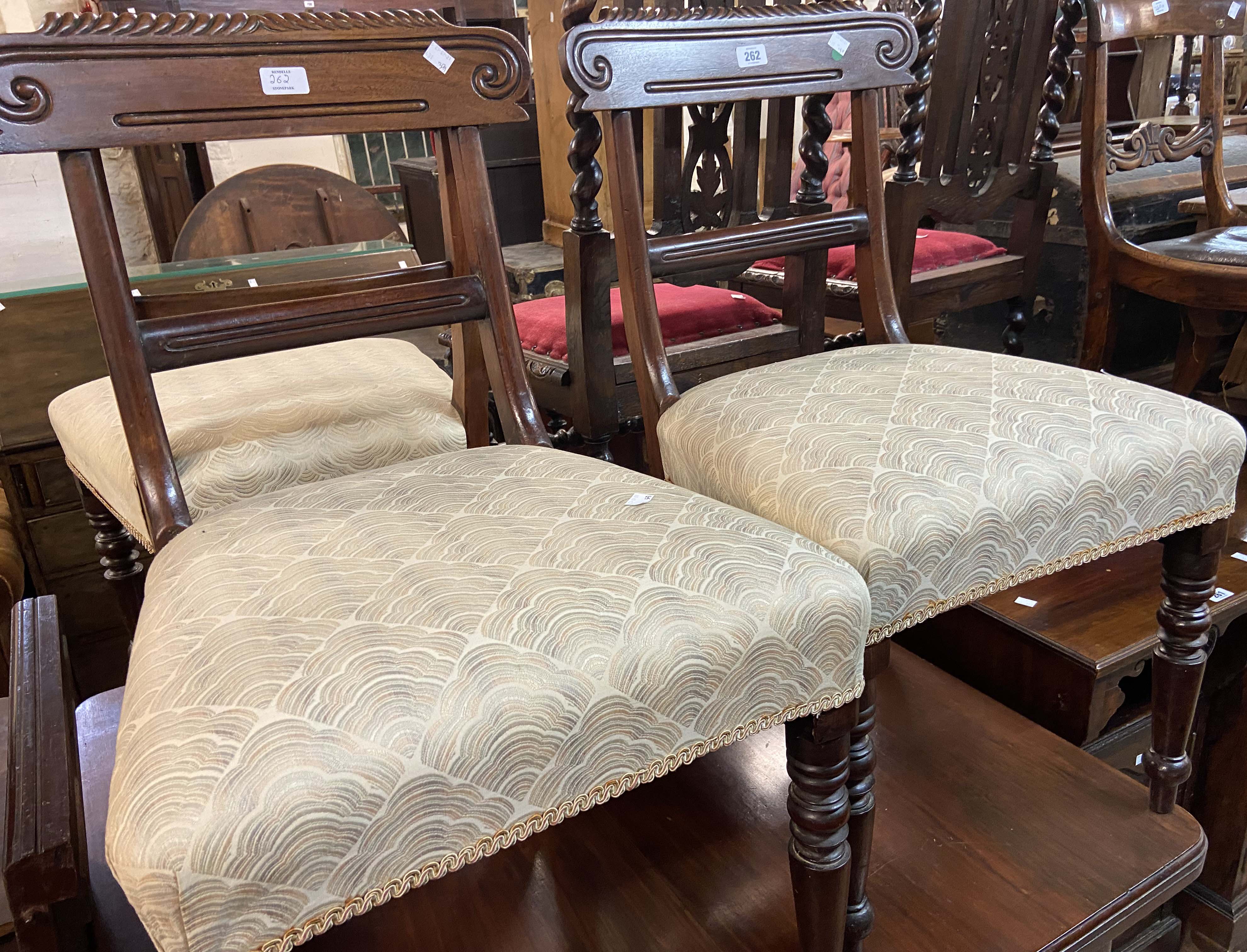 Three matching late Regency mahogany framed dining chairs with modern upholstery to seats, set on