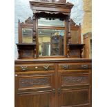 A 1.25m Edwardian carved walnut mirror back sideboard with multiple bevelled plates, shelves and