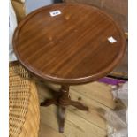 A reproduction mahogany pedestal wine table