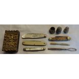 A silver and mother-of-pearl fruit knife, other small penknives, two thimbles and a matchbox sleeve,