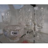 A set of five Waterford Crystal cut glass champagne flutes - sold with another cut wine glass and