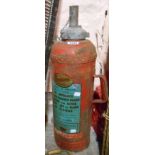 A vintage Conquest water type fire extinguisher in red livery with transfer printed decal