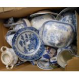 A box containing assorted ceramic items including blue and white tureens, etc.
