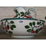 A Wemyss Ware pottery jug and bowl set decorated with hand painted cherries - a/f